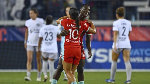 Temwa Chawinga (6) is congratulated by teammate Lo'eau LaBonta (10), The Canadian Press Temwa Chawinga (6) is congratulated by teammate Lo'eau LaBonta (10)