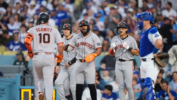 Casey Schmitt and Giants celebrate, The Canadian Press Casey Schmitt and Giants celebrate