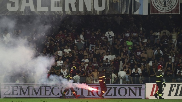 Flares on the pitch at Salernitana, The Canadian Press Flares on the pitch at Salernitana